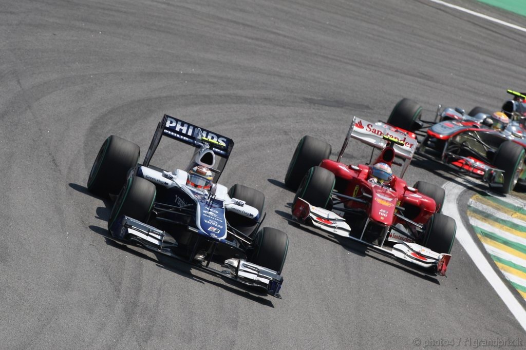 GP Brasile, Gara, Nico Hulkenberg (GER), Williams, FW32 e Fernando Alonso (ESP), Ferrari, F10 