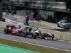 GP Brasile, Gara, Jenson Button (GBR), McLaren  Mercedes, MP4-25 e Michael Schumacher (GER), Mercedes GP  F1 Team, MGP W01 
