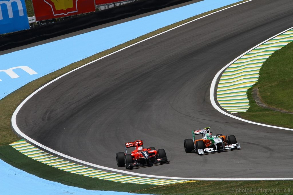 GP Brasile, Prove Libere 1, Venerdi', Timo Glock (GER), Virgin Racing, VR-01  e Vitantonio Liuzzi (ITA), Force India F1 Team, VJM03 