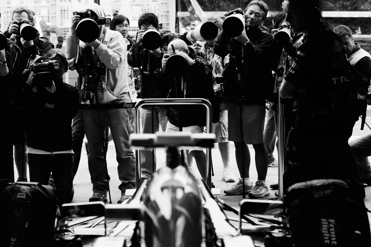 GP AUSTRALIA, MELBOURNE, AUSTRALIA - MARCH 25:  Photographers surround Sebastian Vettel of Germany e Red Bull Racing as he prepares to drive during practice for the Australian Formula One Grand Prix at the Albert Park Circuit on March 25, 2011 in Melbourne, Australia.  (Photo by Mark Thompson/Getty Images)