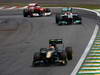 GP BRASILE, 27.11.2011- Gara, Jarno Trulli (ITA), Team Lotus, TL11 e Michael Schumacher (GER), Mercedes GP Petronas F1 Team, MGP W02 