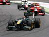 GP BRASILE, 27.11.2011- Gara, Jarno Trulli (ITA), Team Lotus, TL11 e Timo Glock (GER), Marussia Virgin Racing VR-02 