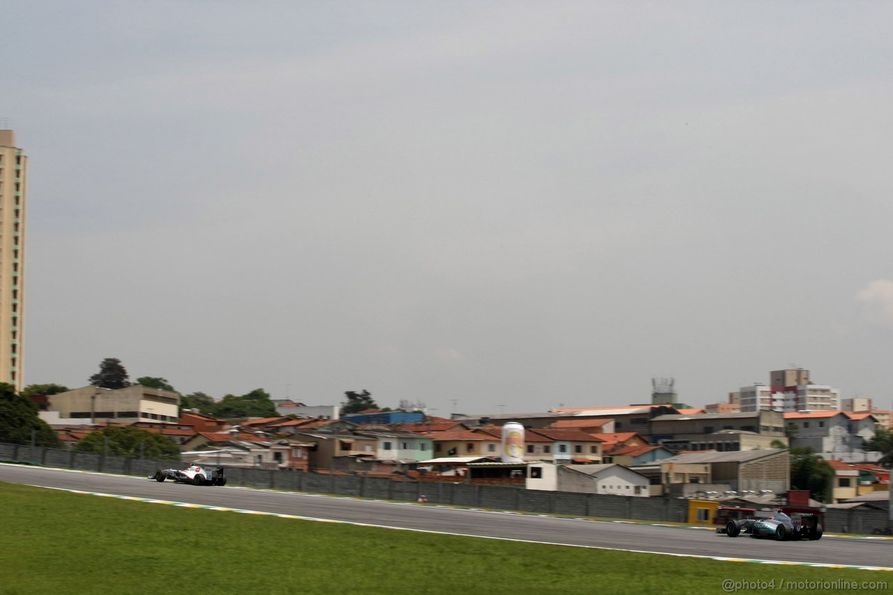 GP BRASILE, 26.11.2011- Prove Libere 3, Sabato, Sergio Prez (MEX), Sauber F1 Team C30 e Michael Schumacher (GER), Mercedes GP Petronas F1 Team, MGP W02 