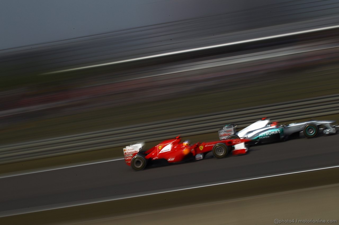 GP CINA, 17.04.2011- Gara, Fernando Alonso (ESP), Ferrari, F-150 Italia e Michael Schumacher (GER), Mercedes GP Petronas F1 Team, MGP W02