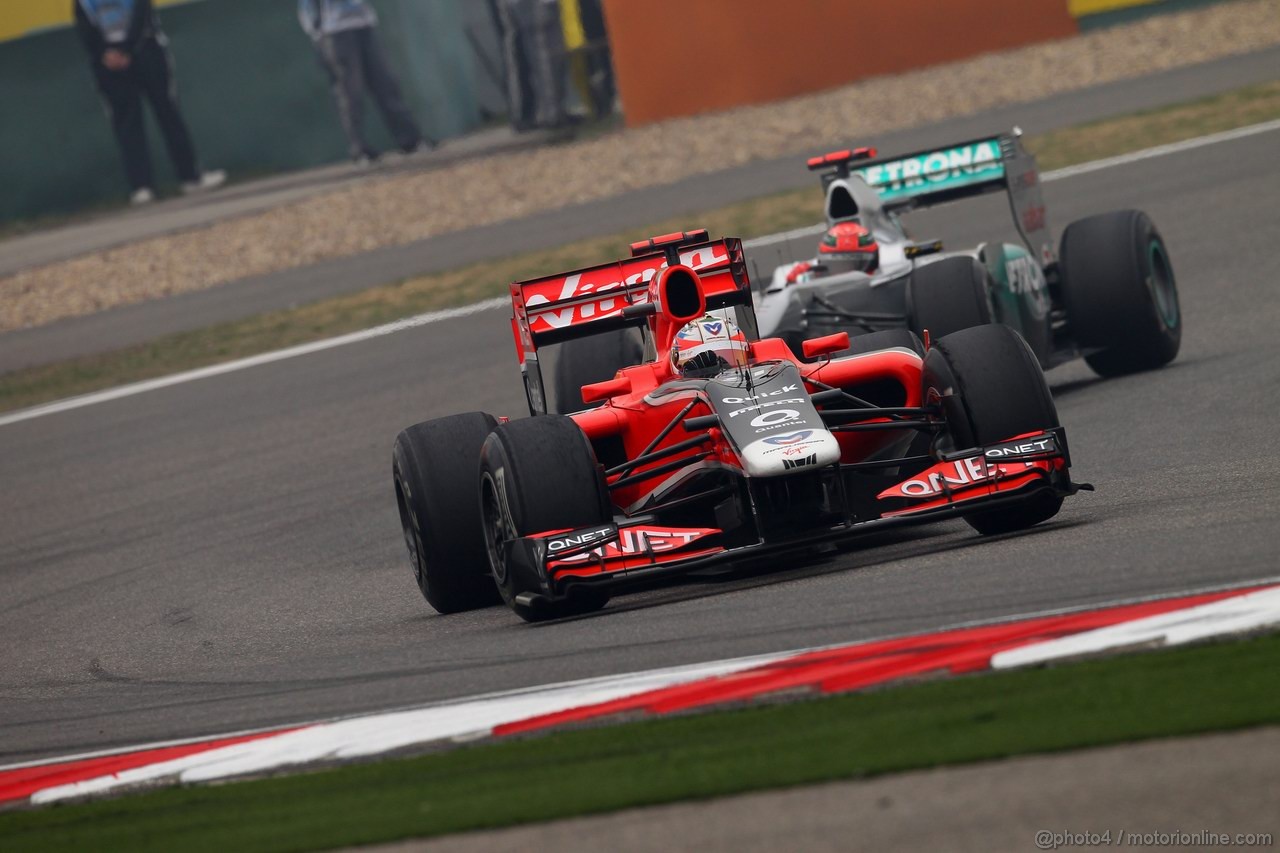GP CINA, 15.04.2011- Prove Libere 1, Venerdi', Timo Glock (GER), Marussia Virgin Racing VR-02 davanti a Michael Schumacher (GER), Mercedes GP Petronas F1 Team, MGP W02 