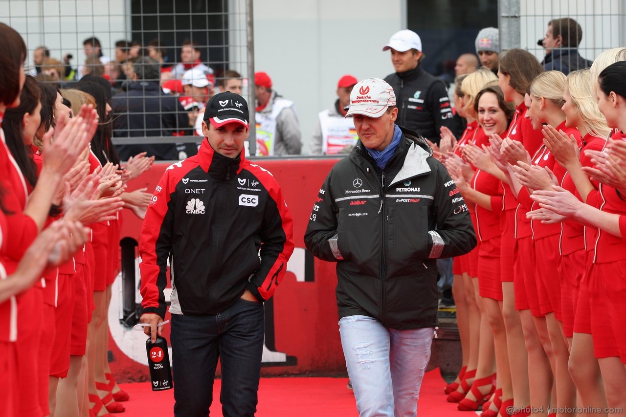 GP GERMANIA, 24.07.2011- Timo Glock (GER), Marussia Virgin Racing VR-02 e Michael Schumacher (GER), Mercedes GP Petronas F1 Team, MGP W02 