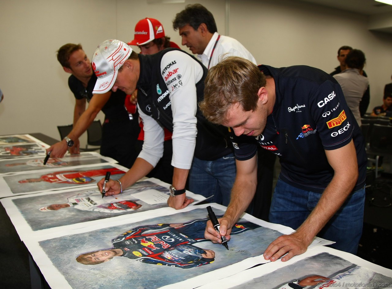 GP GIAPPONE, 07.10.2011- The 5 world champions with signed photos commissioned by Bernie Ecclestone (GBR) to then be put up for auction to raise money for the Japanese disaster, Jenson Button (GBR), McLaren  Mercedes, MP4-26, Fernando Alonso (ESP), Ferrari, F-150 Italia, Michael Schumacher (GER), Mercedes GP Petronas F1 Team, MGP W02, Sebastian Vettel (GER), Red Bull Racing, RB7 