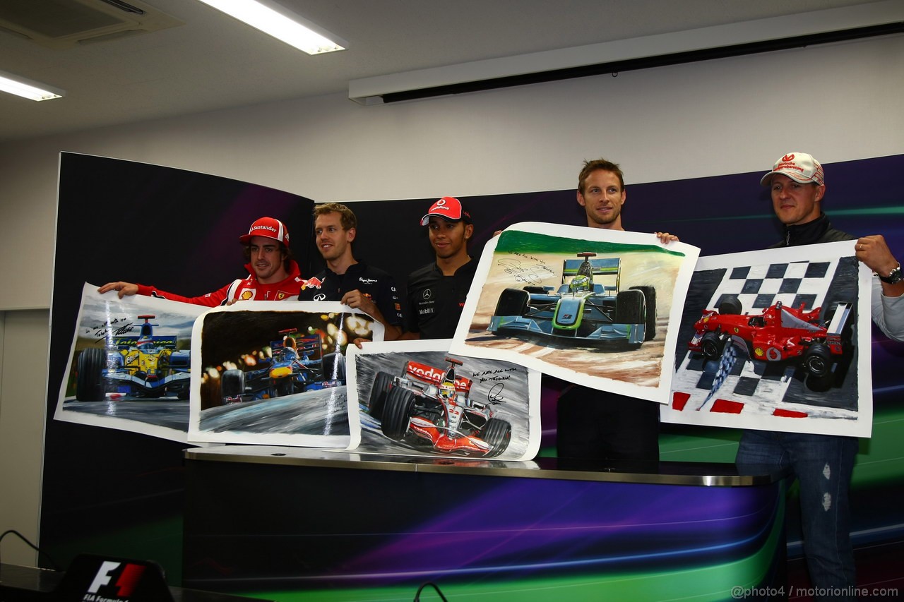 GP GIAPPONE, 07.10.2011- The 5 world champions with signed photos commissioned by Bernie Ecclestone (GBR) to then be put up for auction to raise money for the Japanese disaster, Jenson Button (GBR), McLaren  Mercedes, MP4-26, Fernando Alonso (ESP), Ferrari, F-150 Italia, Michael Schumacher (GER), Mercedes GP Petronas F1 Team, MGP W02, Sebastian Vettel (GER), Red Bull Racing, RB7 e Lewis Hamilton (GBR), McLaren  Mercedes, MP4-26