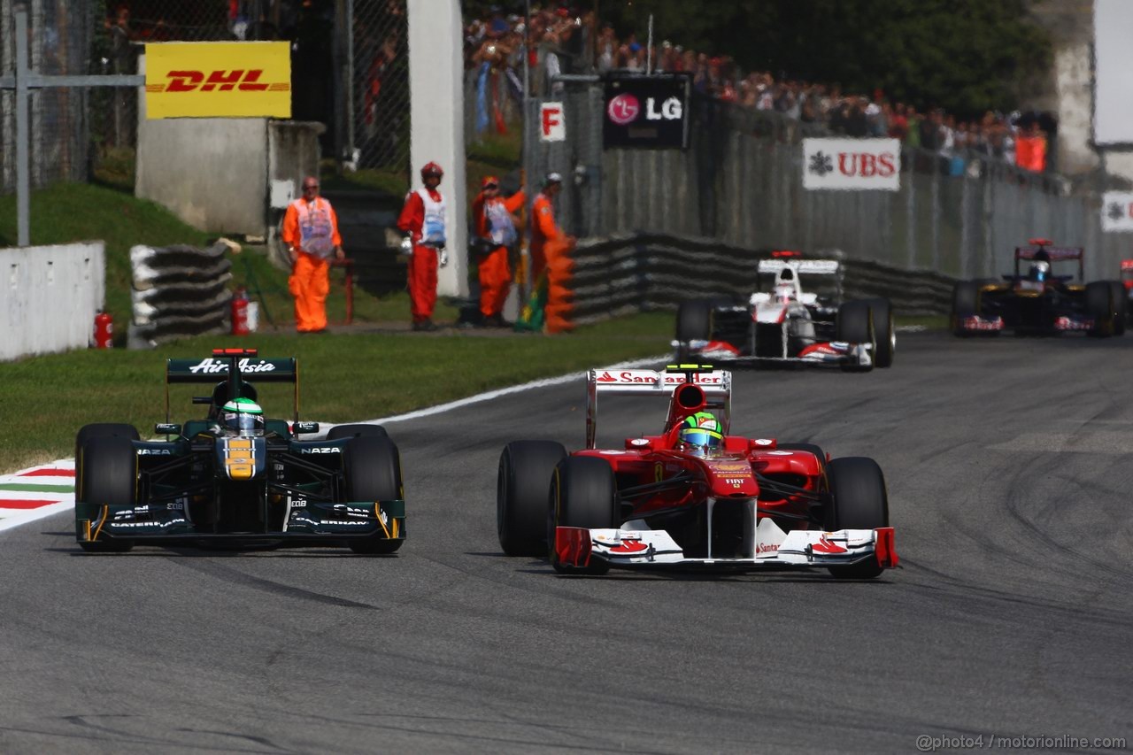 GP ITALIA, 11.09.2011- Gara, Heikki Kovalainen (FIN), Team Lotus, TL11 e Felipe Massa (BRA), Ferrari, F-150 Italia 