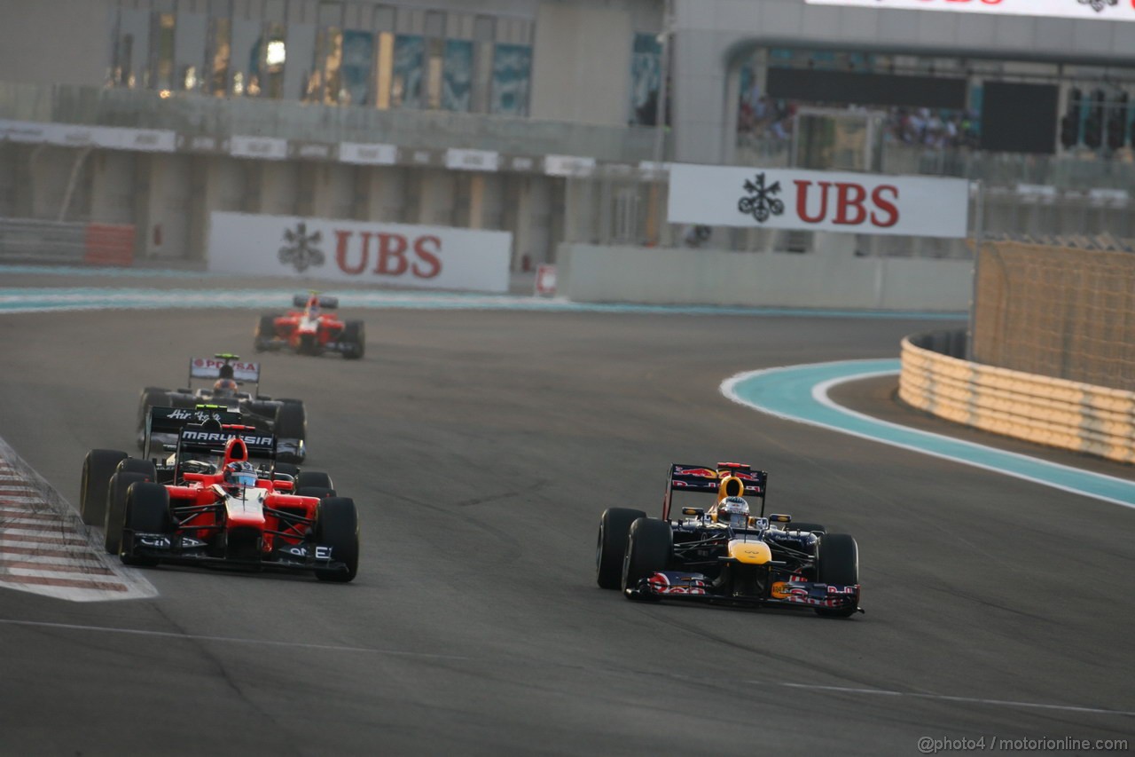 GP ABU DHABI, Gara: Sebastian Vettel (GER) Red Bull Racing RB8 overtakes Timo Glock (GER) Marussia F1 Team MR01