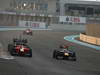 GP ABU DHABI, Gara: Sebastian Vettel (GER) Red Bull Racing RB8 overtakes Timo Glock (GER) Marussia F1 Team MR01