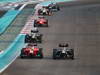 GP ABU DHABI, Gara: Heikki Kovalainen (FIN) Caterham F1 Team CT01 overtakes Timo Glock (GER) Marussia F1 Team MR01
