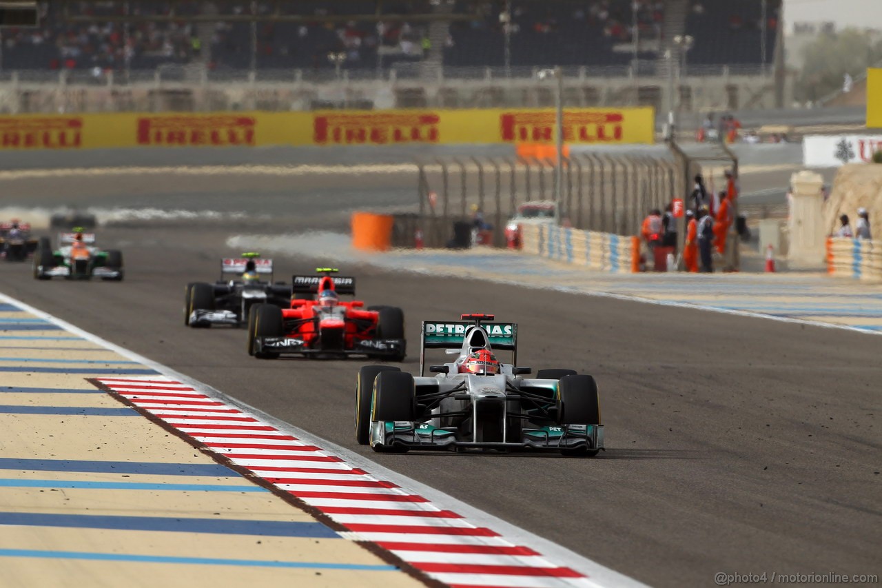 GP BAHRAIN, 22.04.2012- Gara, Michael Schumacher (GER) Mercedes AMG F1 W03 davanti a Charles Pic (FRA) Marussia F1 Team MR01 