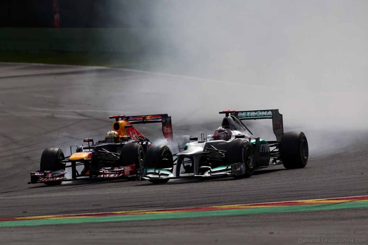 GP BELGIO, 02.09.2012- Gara, Sebastian Vettel (GER) Red Bull Racing RB8 e Michael Schumacher (GER) Mercedes AMG F1 W03 
