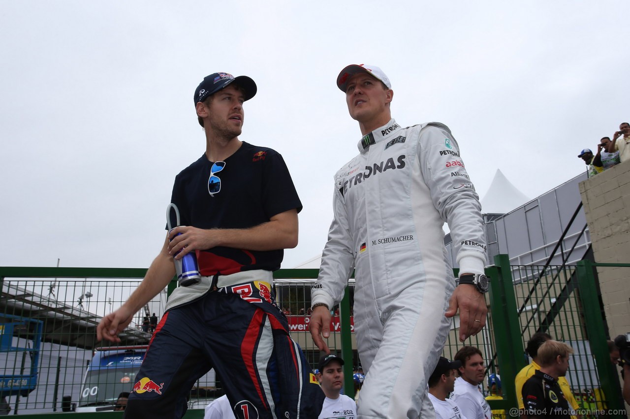 GP BRASILE, 25.11.2012- Sebastian Vettel (GER) Red Bull Racing RB8 e Michael Schumacher (GER) Mercedes AMG F1 W03 