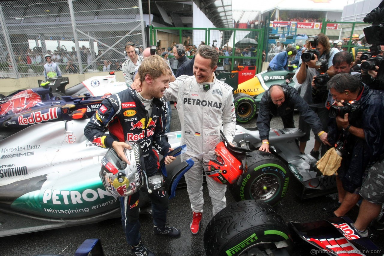 GP BRASILE, 25.11.2012- Gara, Sebastian Vettel (GER) Red Bull Racing RB8, world champion 2012 with Michael Schumacher (GER) Mercedes AMG F1 W03 