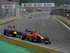 GP BRASILE, 25.11.2012- Gara, Charles Pic (FRA) Marussia F1 Team MR01 davanti a Sebastian Vettel (GER) Red Bull Racing RB8 