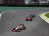 GP BRASILE, 25.11.2012- Gara, Pedro de la Rosa (ESP) HRT Formula 1 Team F112 davanti a Charles Pic (FRA) Marussia F1 Team MR01 
