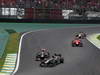 GP BRASILE, 25.11.2012- Gara, Heikki Kovalainen (FIN) Caterham F1 Team CT01 e Daniel Ricciardo (AUS) Scuderia Toro Rosso STR7 