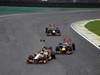 GP BRASILE, 25.11.2012- Gara, Pedro de la Rosa (ESP) HRT Formula 1 Team F112 e Sebastian Vettel (GER) Red Bull Racing RB8 