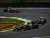 GP BRASILE, 25.11.2012- Gara, Kimi Raikkonen (FIN) Lotus F1 Team E20 e Daniel Ricciardo (AUS) Scuderia Toro Rosso STR7 