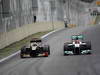 GP BRASILE, 25.11.2012- Gara, Kimi Raikkonen (FIN) Lotus F1 Team E20 e Michael Schumacher (GER) Mercedes AMG F1 W03