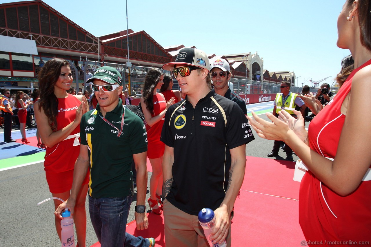 GP EUROPA, 24.06.2012- Heikki Kovalainen (FIN) Caterham F1 Team CT01 e Kimi Raikkonen (FIN) Lotus F1 Team E20 