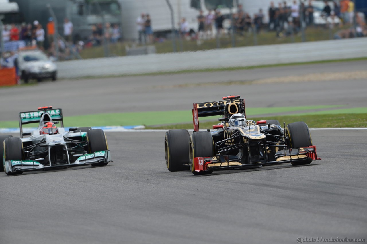 GP GERMANIA, 22.07.2012 - Gara, Kimi Raikkonen (FIN) Lotus F1 Team E20 overtaking Michael Schumacher (GER) Mercedes AMG F1 W03