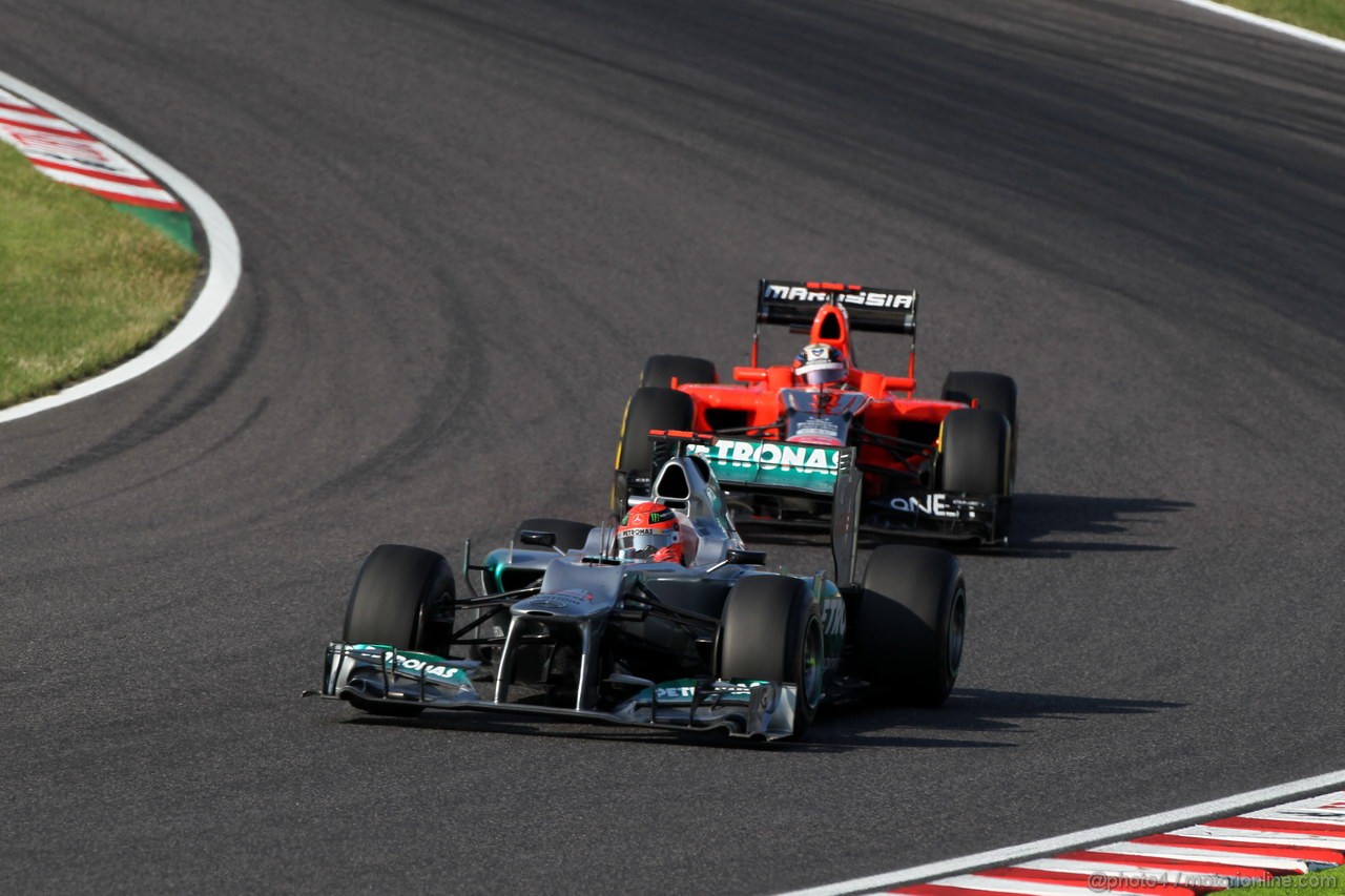 GP GIAPPONE, 07.10.2012- Gara, Michael Schumacher (GER) Mercedes AMG F1 W03 davanti a Timo Glock (GER) Marussia F1 Team MR01 