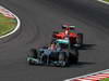 GP GIAPPONE, 07.10.2012- Gara, Michael Schumacher (GER) Mercedes AMG F1 W03 davanti a Timo Glock (GER) Marussia F1 Team MR01 