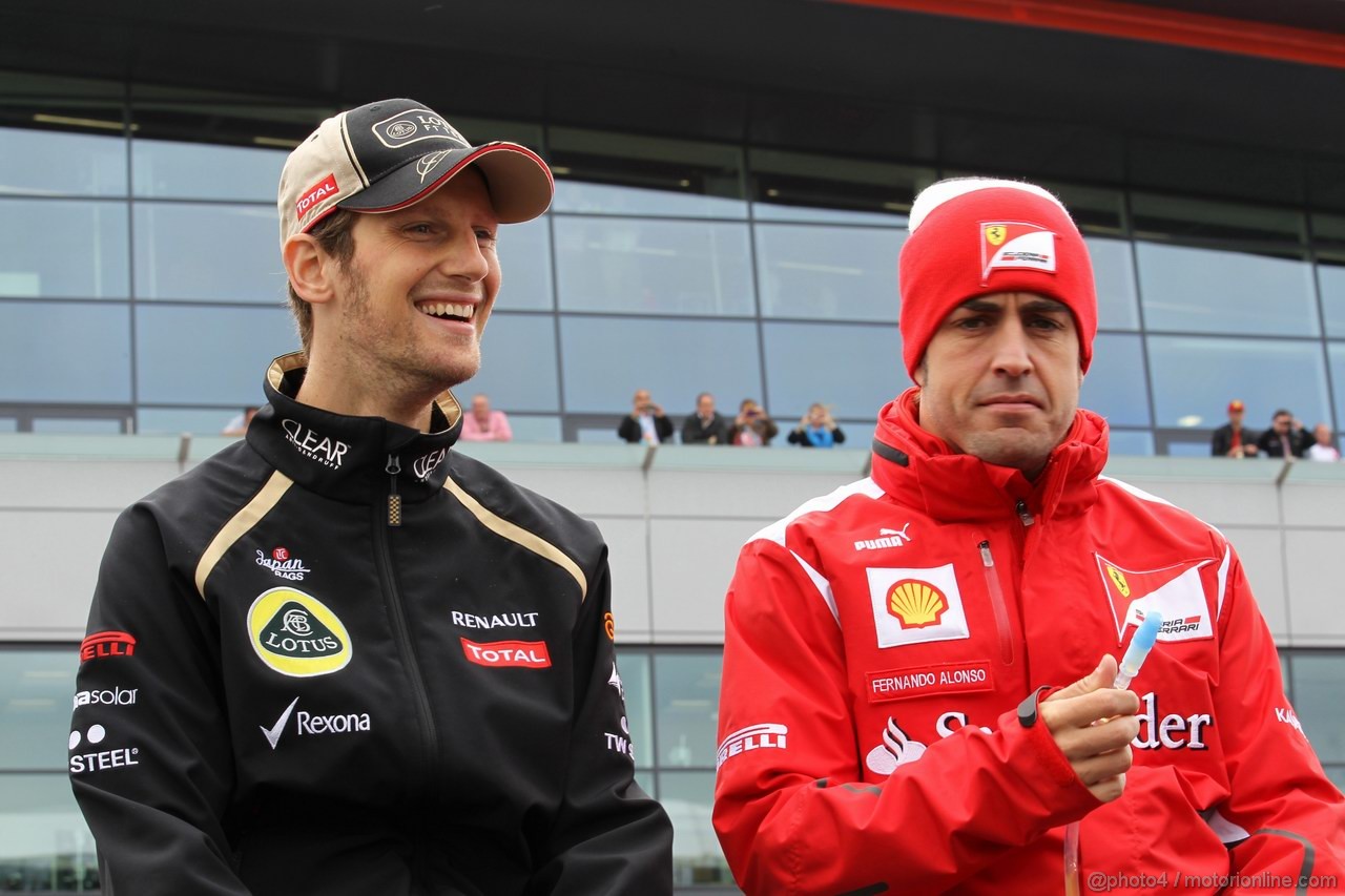 GP GRAN BRETAGNA, 08.07.2012- Romain Grosjean (FRA) Lotus F1 Team E20 e Fernando Alonso (ESP) Ferrari F2012 