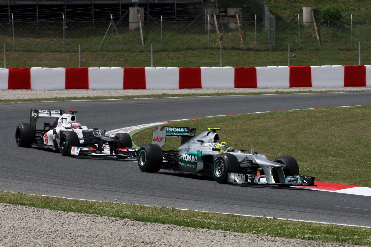 GP SPAGNA, 13.05.2012- Gara, Kamui Kobayashi (JAP) Sauber F1 Team C31 e Nico Rosberg (GER) Mercedes AMG F1 W03 