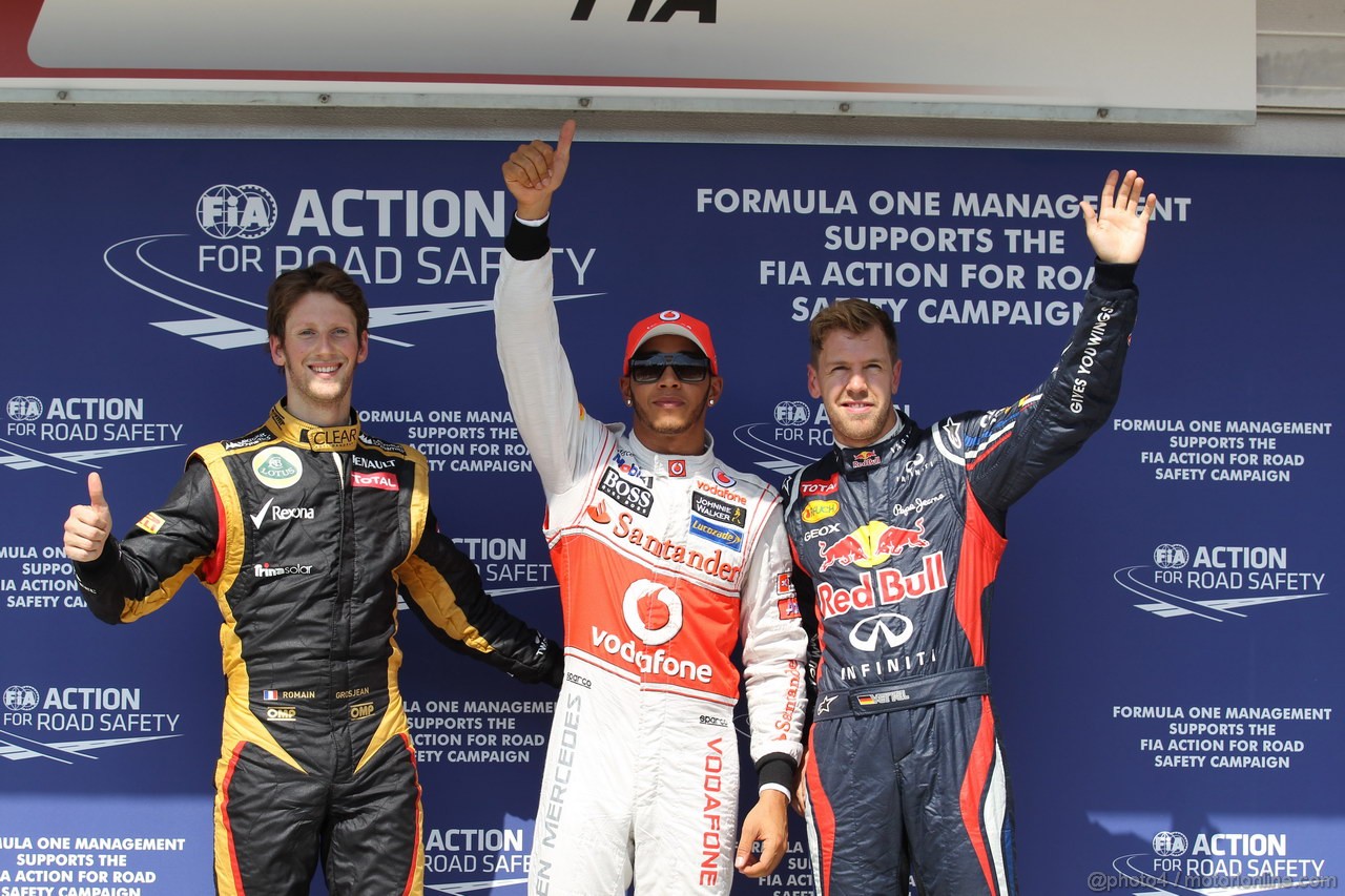 GP UNGHERIA, 28.07.2012- Qualifiche, Romain Grosjean (FRA) Lotus F1 Team E20, lkh e Sebastian Vettel (GER) Red Bull Racing RB8 