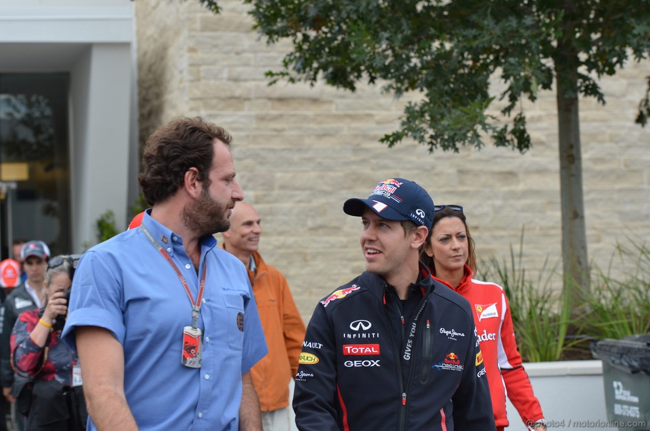 GP USA, 15.11.2012 - Sebastian Vettel (GER) Red Bull Racing RB8 with Matteo Bonciani (ITA) Fia F1  Media Delagate