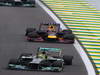 GP BRASILE, 24.11.2013 - Gara, Nico Rosberg (GER) Mercedes AMG F1 W04 davanti a Mark Webber (AUS) Red Bull Racing RB9 