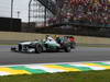 GP BRASILE, 24.11.2013 - Gara, Nico Rosberg (GER) Mercedes AMG F1 W04 e Mark Webber (AUS) Red Bull Racing RB9 