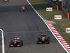 GP CINA, 14.04.2013- Gara, Jenson Button (GBR) McLaren Mercedes MP4-28 e Kimi Raikkonen (FIN) Lotus F1 Team E21 