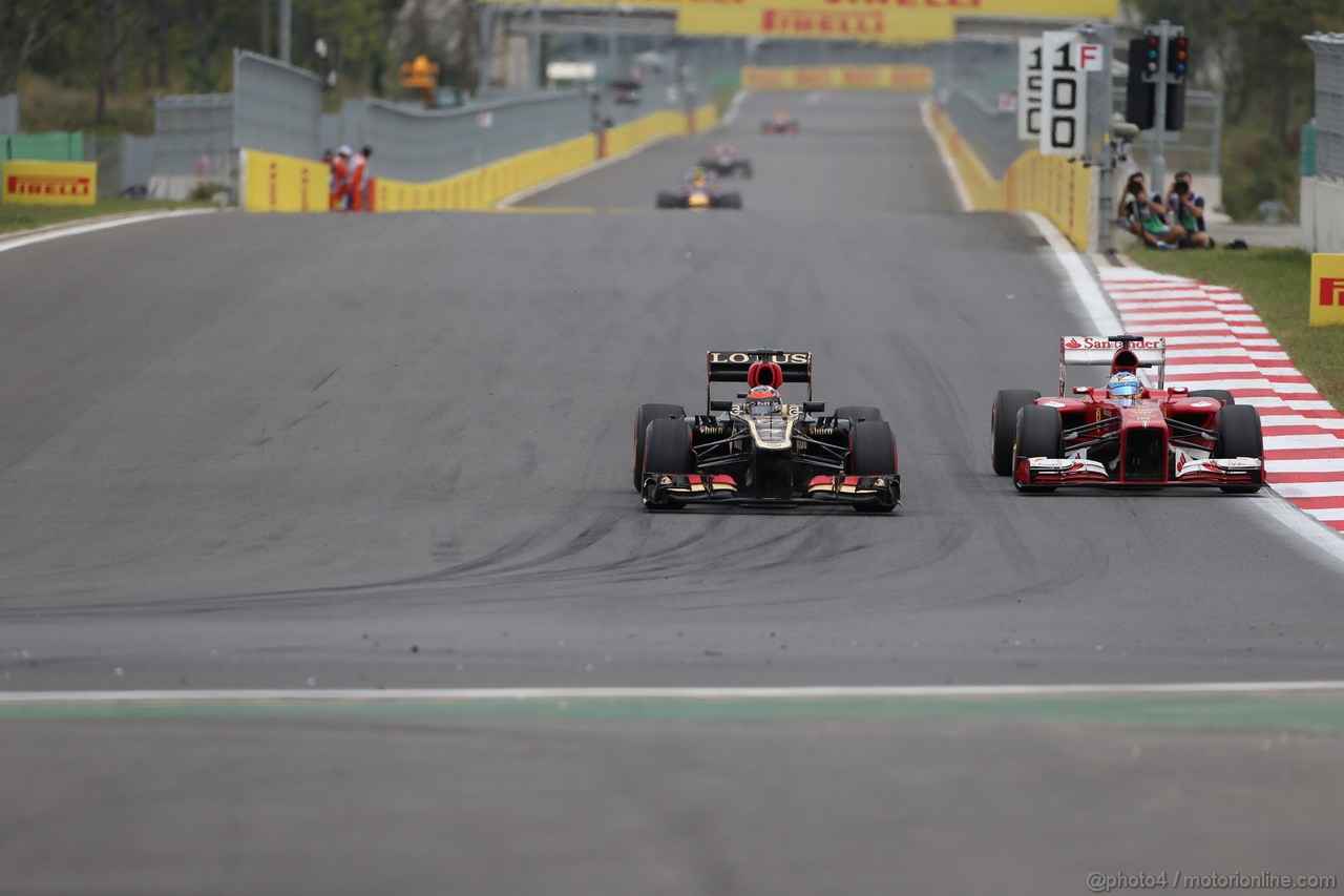 GP COREA, 06.10.2013- Gara, Kimi Raikkonen (FIN) Lotus F1 Team E21 overtakes Fernando Alonso (ESP) Ferrari F138