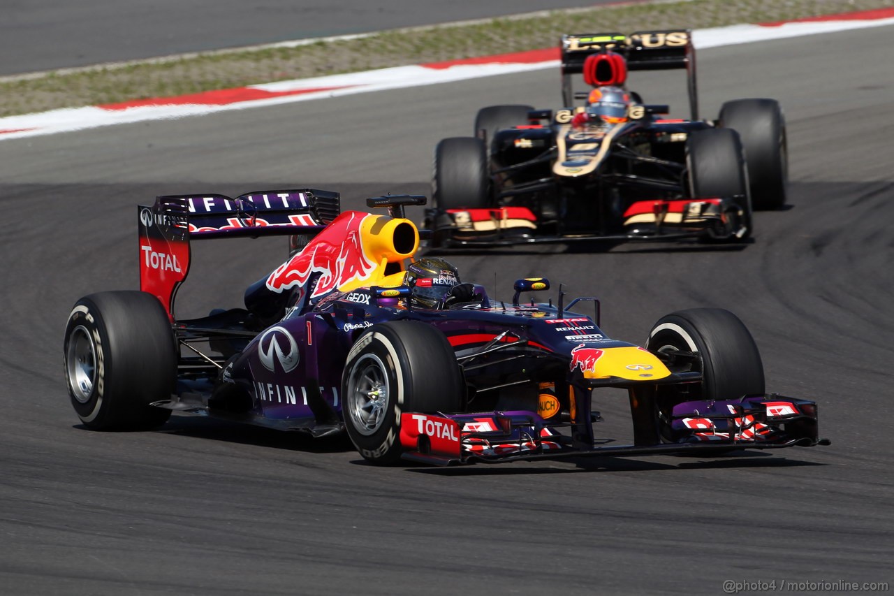 GP GERMANIA, 07.07.2013-  Gara, Sebastian Vettel (GER) Red Bull Racing RB9 davanti a Romain Grosjean (FRA) Lotus F1 Team E21 