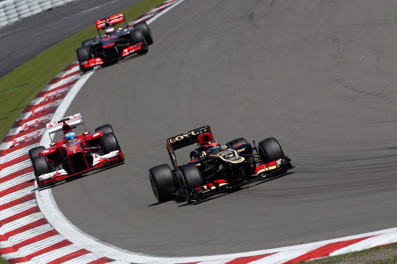 GP GERMANIA, 07.07.2013-  Gara, Kimi Raikkonen (FIN) Lotus F1 Team E21 davanti a Fernando Alonso (ESP) Ferrari F138 