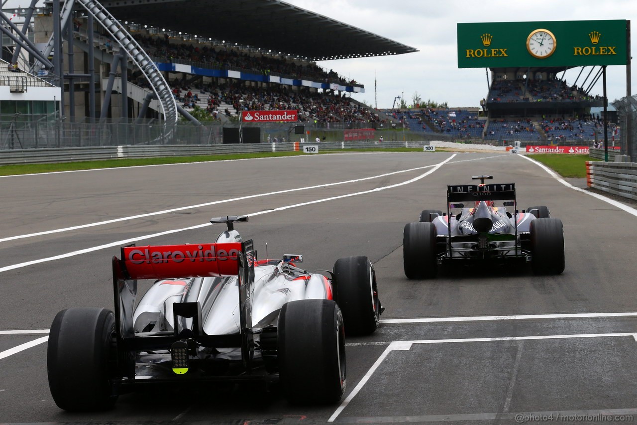 GP GERMANIA, 05.07.2013- Prove Libere 1, Jenson Button (GBR) McLaren Mercedes MP4-28 e Sebastian Vettel (GER) Red Bull Racing RB9 