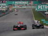 GP MALESIA, 24.03.2013- Gara, Jenson Button (GBR) McLaren Mercedes MP4-28 overtaking Nico Hulkenberg (GER) Sauber F1 Team C32 