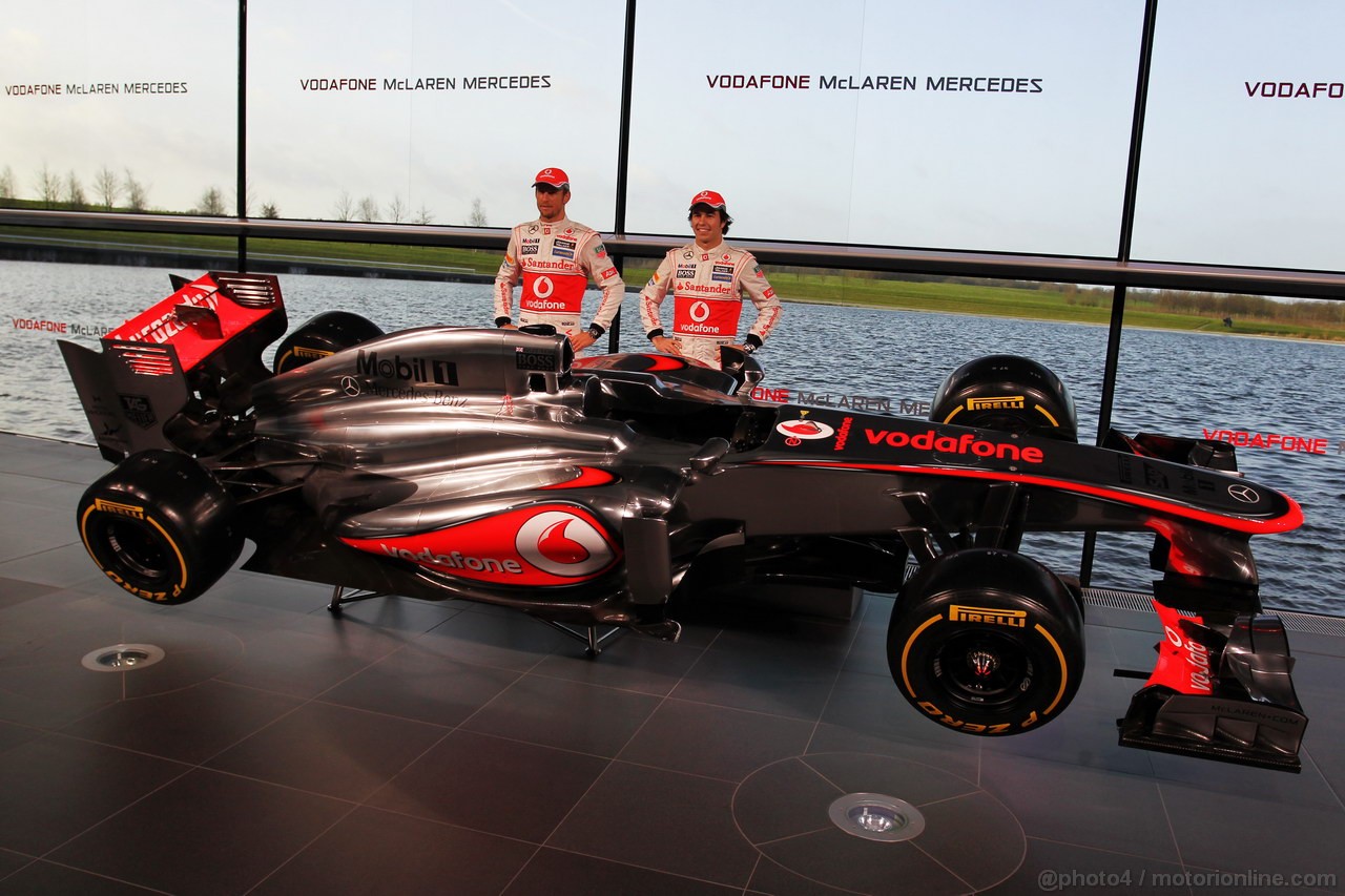 MCLAREN MP4-28, (L to R): Jenson Button (GBR) McLaren e team mate Sergio Perez (MEX) McLaren with the new McLaren MP4-28.
31.01.2013. McLaren MP4-28 Launch, McLaren Technology Centre, Woking, England.
