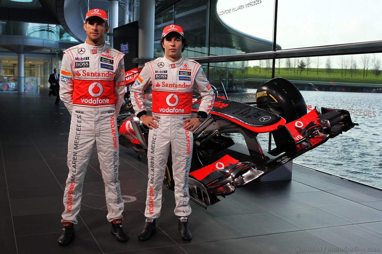 MCLAREN MP4-28, (L to R): Jenson Button (GBR) McLaren e team mate Sergio Perez (MEX) McLaren with the new McLaren MP4-28.
31.01.2013. McLaren MP4-28 Launch, McLaren Technology Centre, Woking, England.
