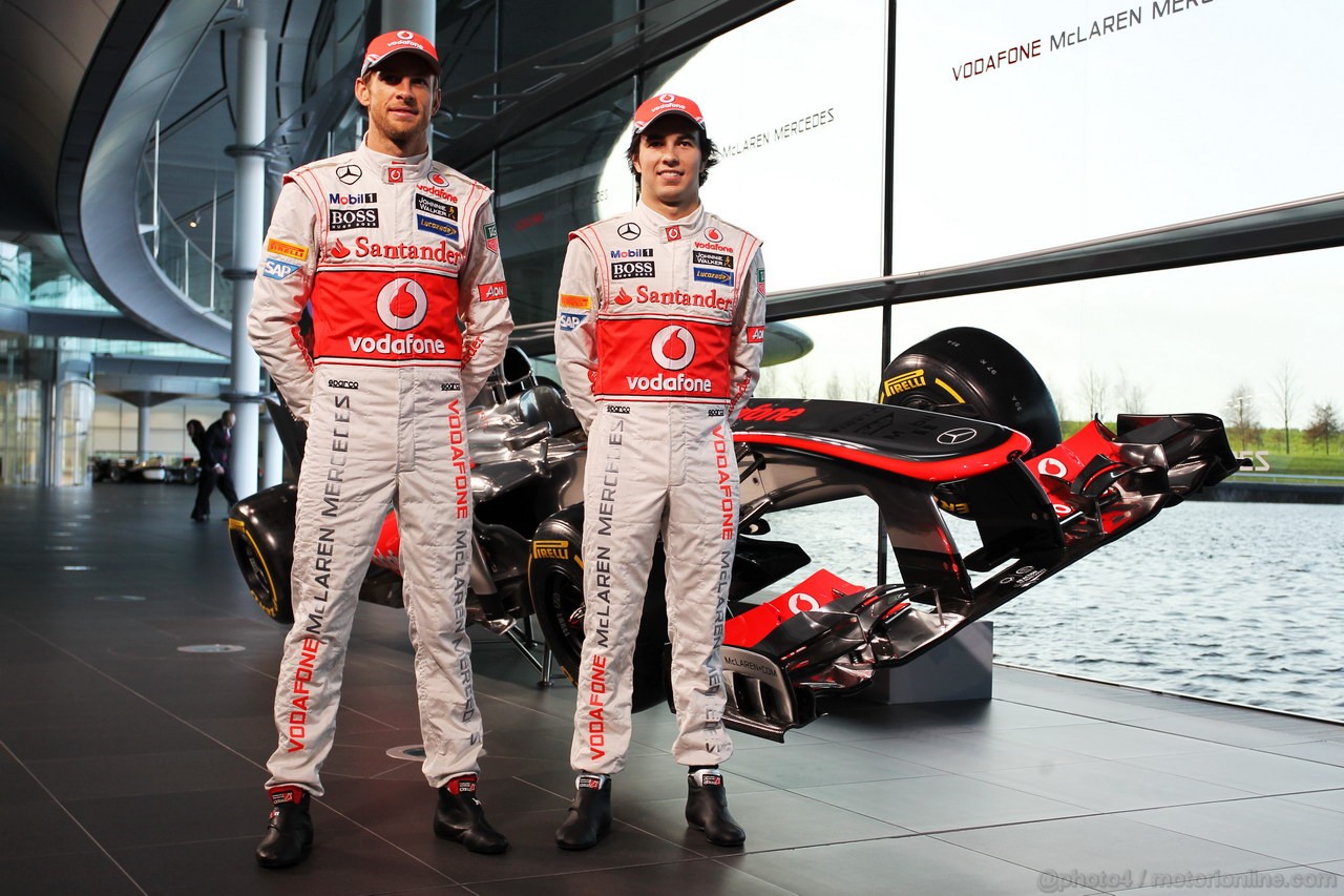 MCLAREN MP4-28, (L to R): Jenson Button (GBR) McLaren e team mate Sergio Perez (MEX) McLaren with the new McLaren MP4-28.
31.01.2013. McLaren MP4-28 Launch, McLaren Technology Centre, Woking, England.
