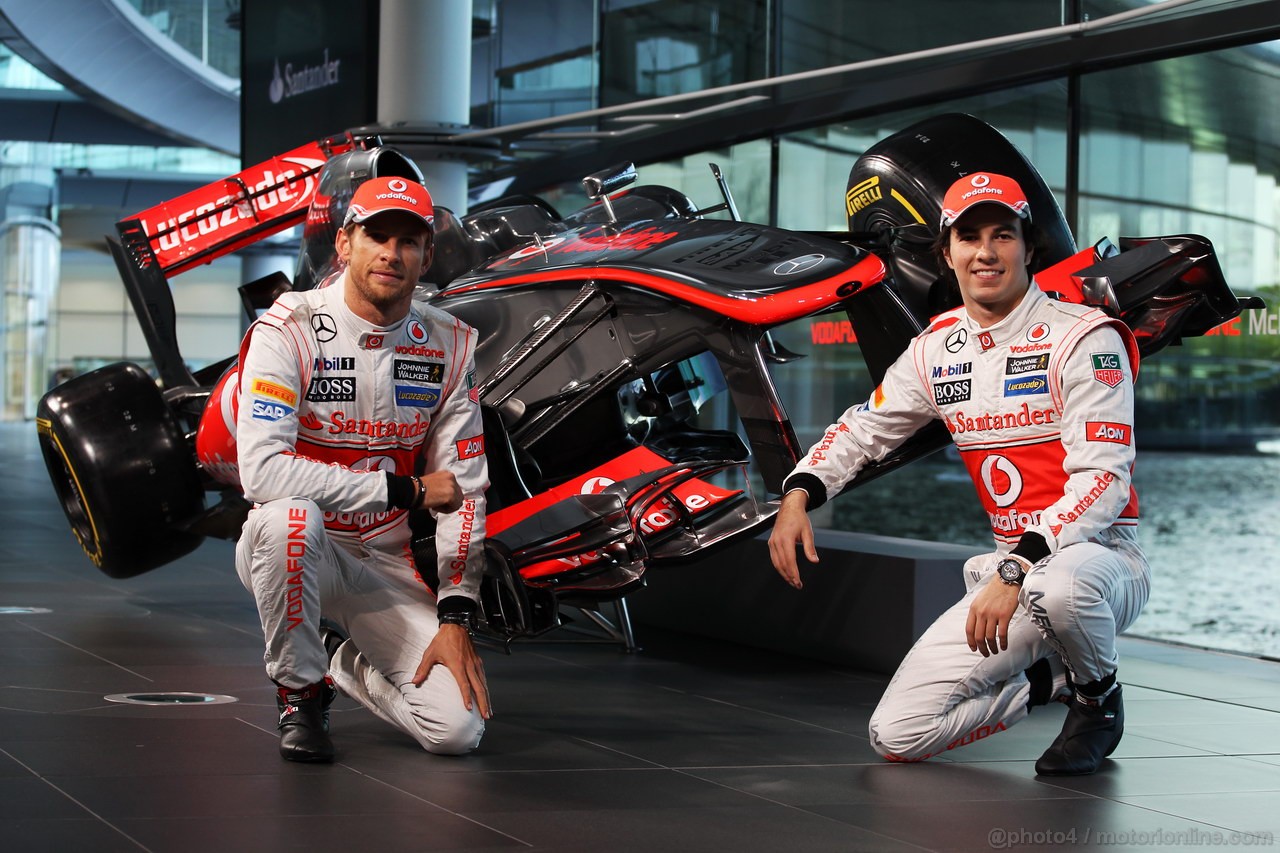 MCLAREN MP4-28, (L to R): Jenson Button (GBR) McLaren e team mate Sergio Perez (MEX) McLaren with the new McLaren MP4-28.
31.01.2013. McLaren MP4-28 Launch, McLaren Technology Centre, Woking, England.
