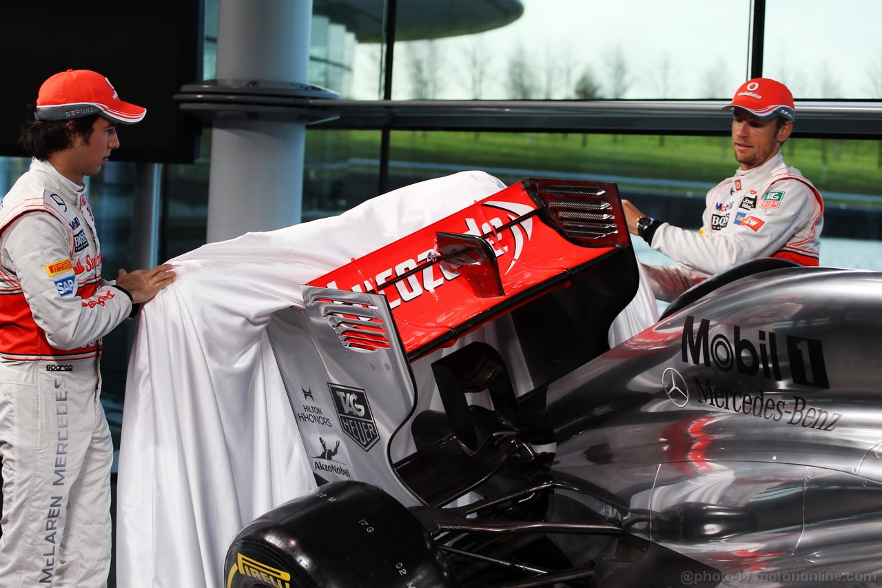 MCLAREN MP4-28, (L to R): Sergio Perez (MEX) McLaren e team mate Jenson Button (GBR) McLaren unveil the new McLaren MP4-28.
31.01.2013. McLaren MP4-28 Launch, McLaren Technology Centre, Woking, England.
