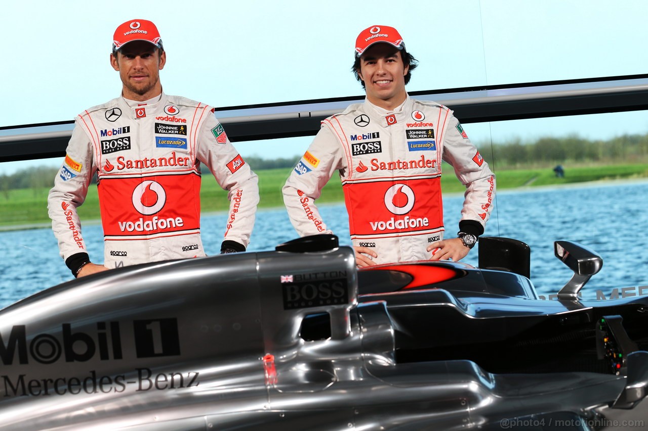 MCLAREN MP4-28, (L to R): Jenson Button (GBR) McLaren with team mate Sergio Perez (MEX) McLaren e the new McLaren MP4-28.
31.01.2013. McLaren MP4-28 Launch, McLaren Technology Centre, Woking, England.
