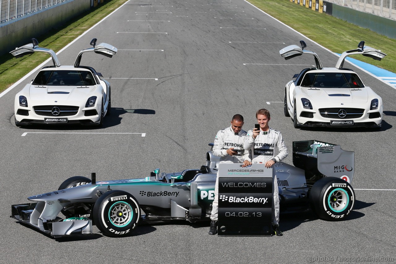 MERCEDES F1 W04, (L to R): Lewis Hamilton (GBR) Mercedes AMG F1 e team mate Nico Rosberg (GER) Mercedes AMG F1 with the new Mercedes AMG F1 W04 e promote new Blackberry sponsorship for the team.
04.02.2013. Mercedes AMG F1 W04 Launch, Jerez, Spain.
