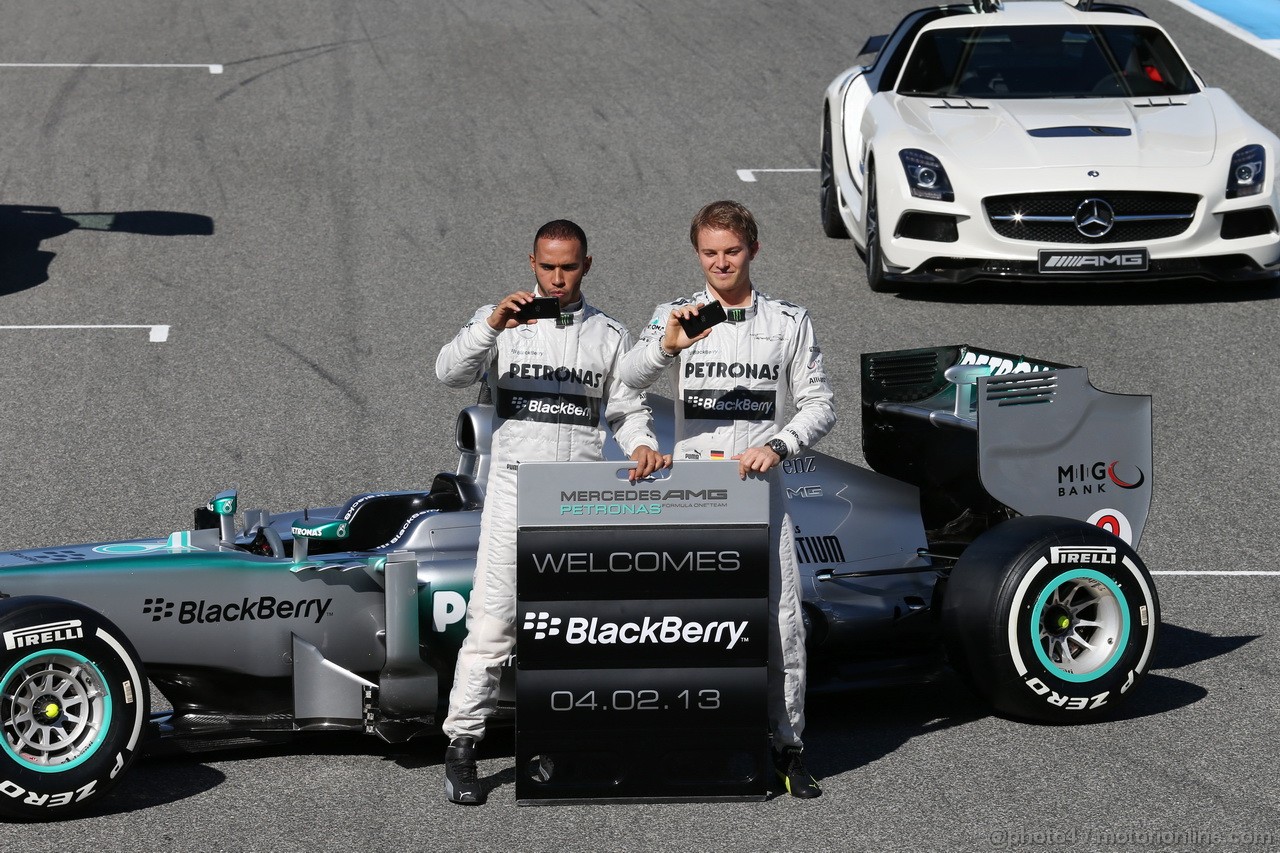 MERCEDES F1 W04, (L to R): Lewis Hamilton (GBR) Mercedes AMG F1 e team mate Nico Rosberg (GER) Mercedes AMG F1 with the new Mercedes AMG F1 W04 e promote new Blackberry sponsorship for the team.
04.02.2013. Mercedes AMG F1 W04 Launch, Jerez, Spain.
